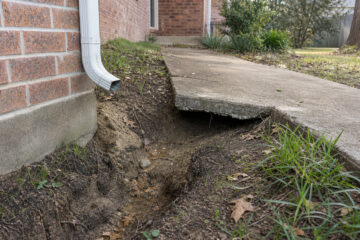 Downspouts, Grading, and Sunken Concrete Around Bryan Homes - concrete service scene in Bryan, Texas